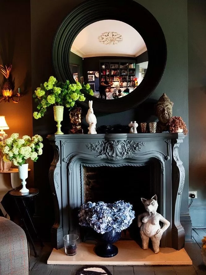 Mirror above a Traditional Fireplace